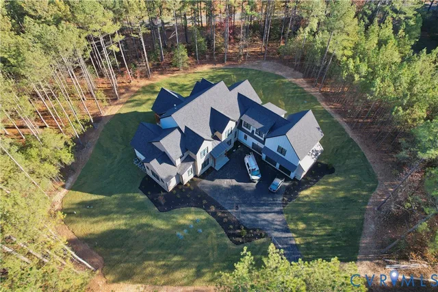 a view of a backyard with sitting area