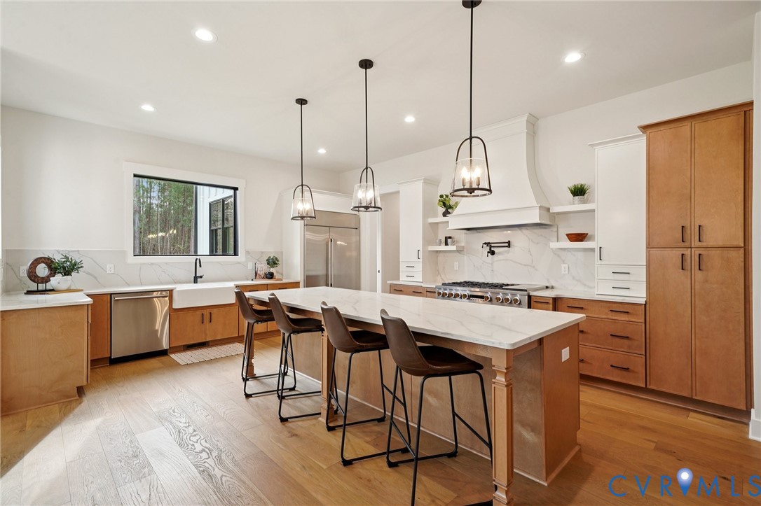 1165 Cardinal Crest Terrace Midlothian, VA 23113 - Photo 6 of 50 a kitchen with a table chairs sink and wooden floor