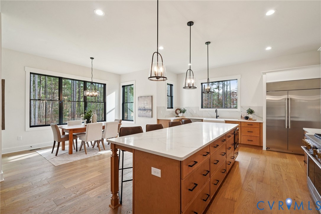 1165 Cardinal Crest Terrace Midlothian, VA 23113 - Photo 9 of 50 a large kitchen with kitchen island a large island in it
