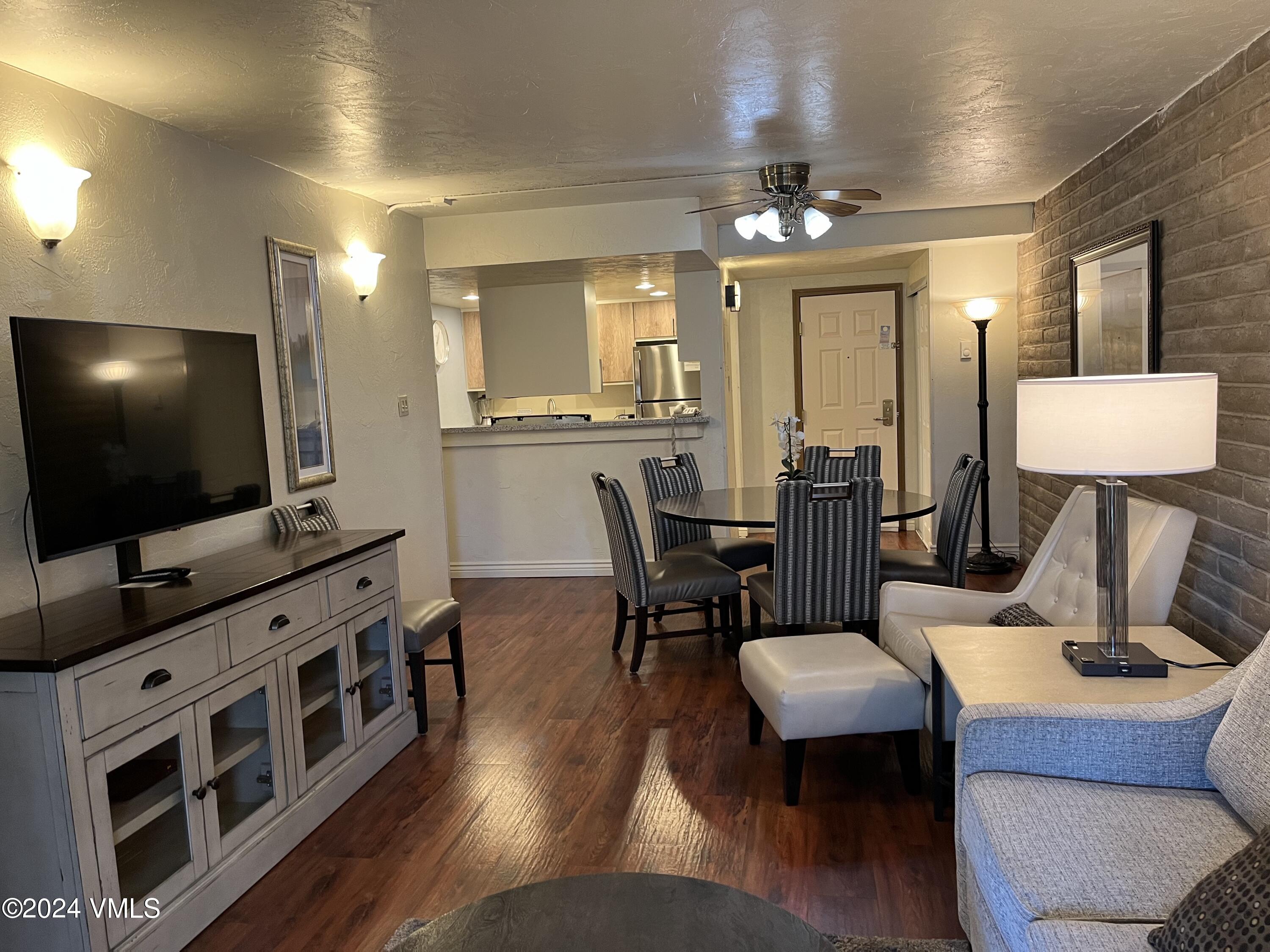 1020 Vail View Drive, Unit 131232 Vail, CO 81657 - Photo 3 of 20 a living room with furniture and a flat screen tv
