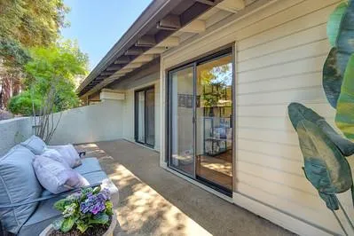 a view of backyard with seating space