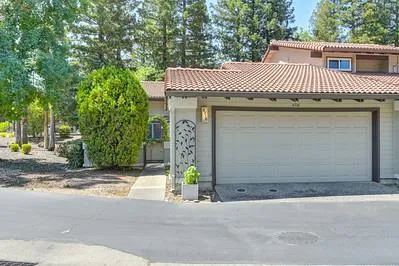 a front view of a house with a garage