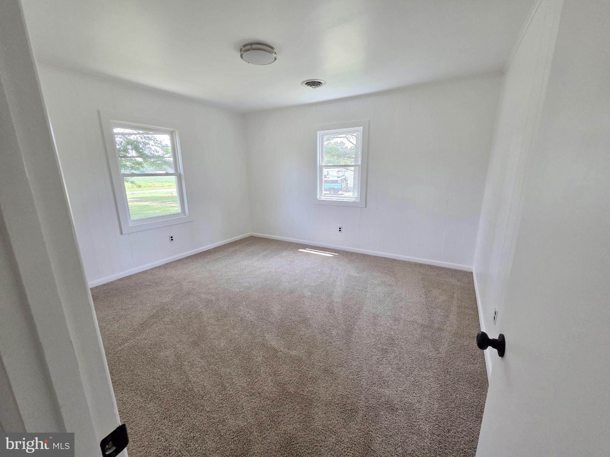 5046 Aireys Road Cambridge, MD 21613 - Photo 15 of 35 an empty room with windows