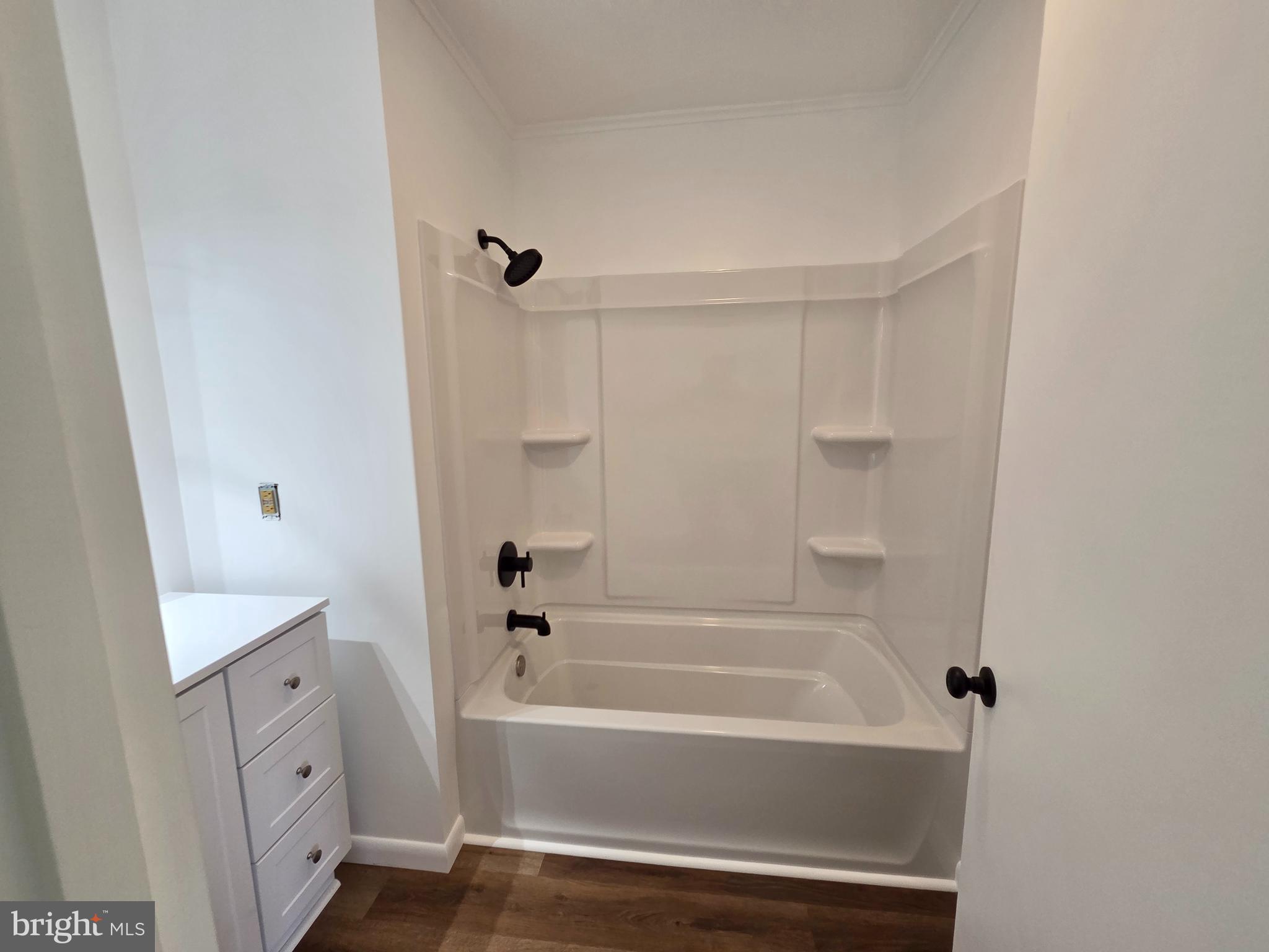 5046 Aireys Road Cambridge, MD 21613 - Photo 17 of 35 a bathroom with a bathtub and a shower