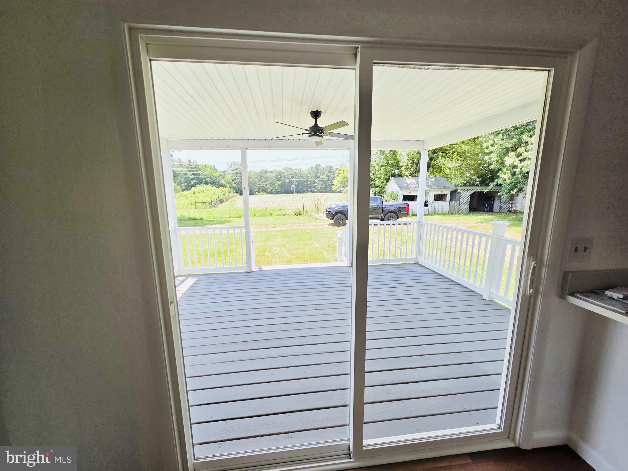 5046 Aireys Road Cambridge, MD 21613 - Photo 24 of 35 a view of a room with wooden floor and a window