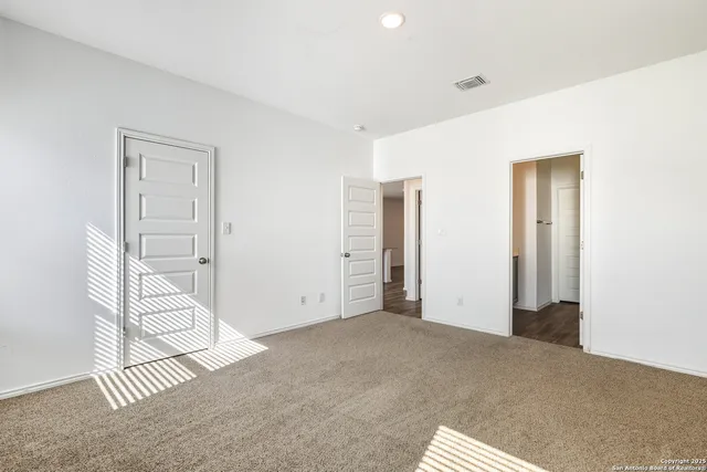 a bathroom with a double vanity sink a mirror and a shower