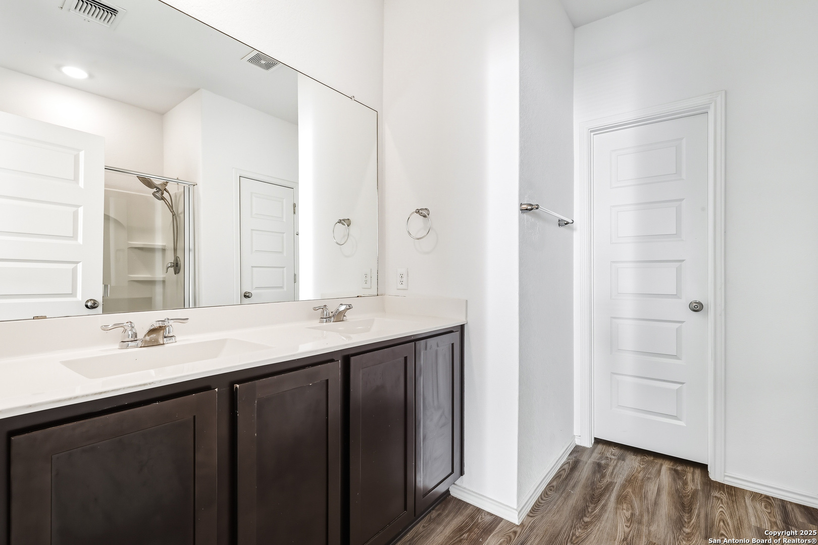 4426 Chandler Road, Unit 3 San Antonio, TX 78222 - Photo 15 of 26 a bathroom with a double vanity sink a mirror and a shower