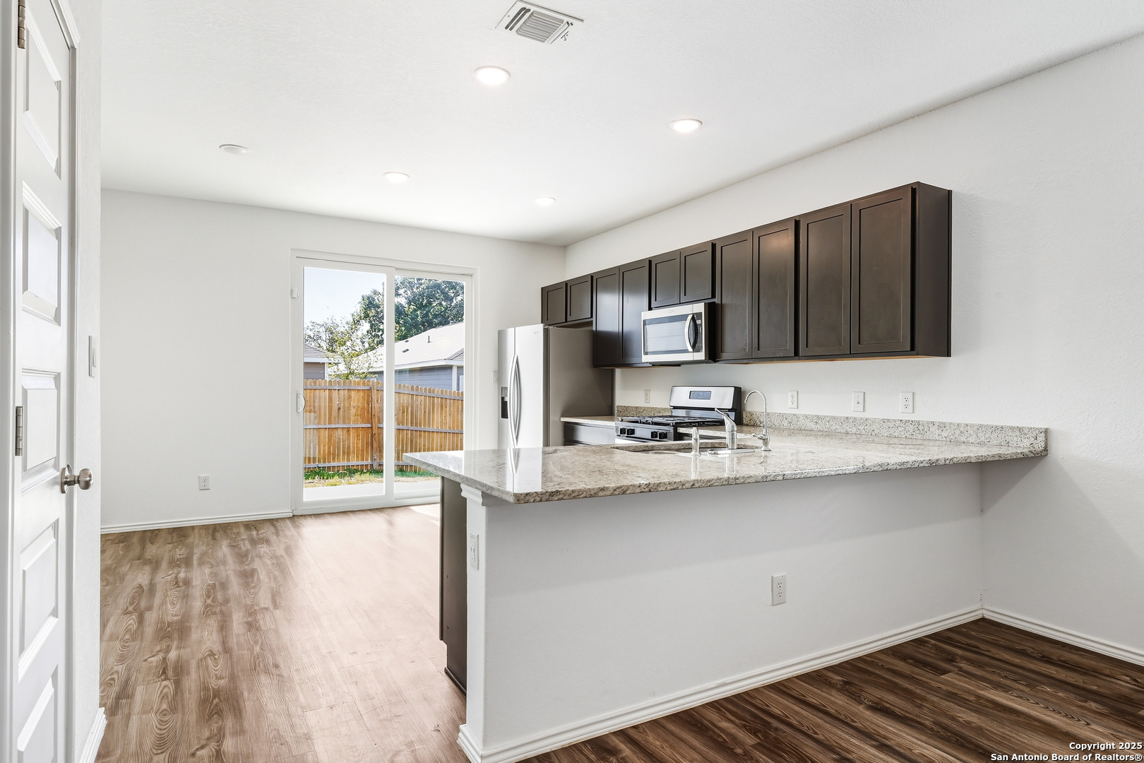 4426 Chandler Road, Unit 3 San Antonio, TX 78222 - Photo 7 of 26 a kitchen with stainless steel appliances a sink stove and cabinets