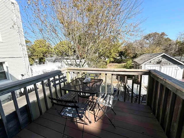 a view of balcony with furniture