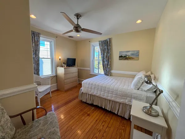 a bedroom with a bed window and couch
