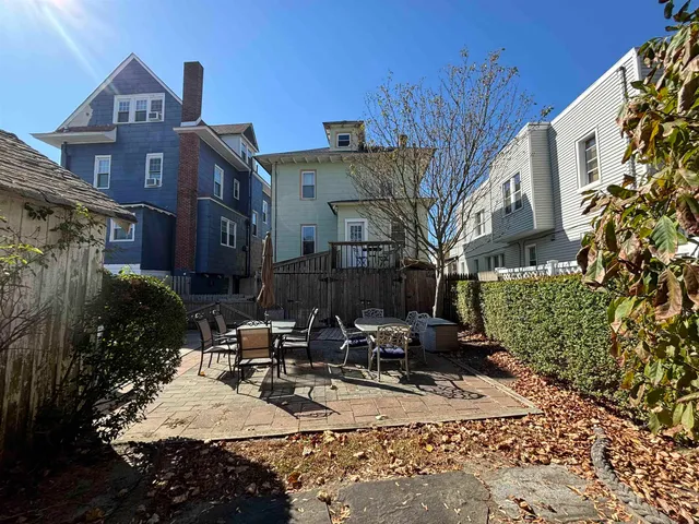 a view of a building with sitting area