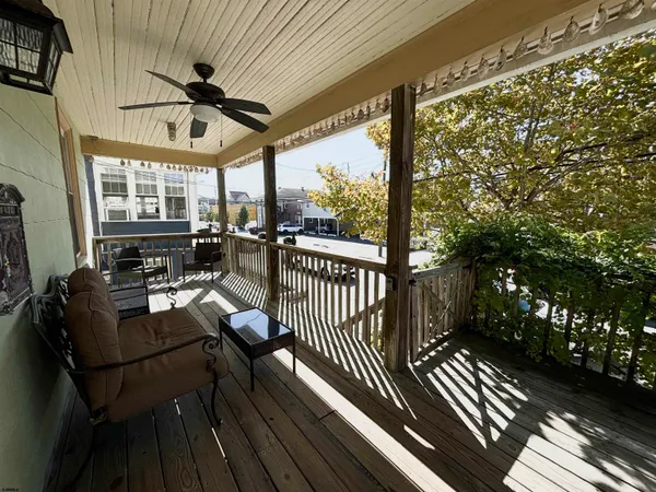 a view of a living room and balcony