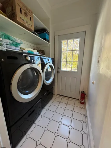 a utility room with dryer and washer