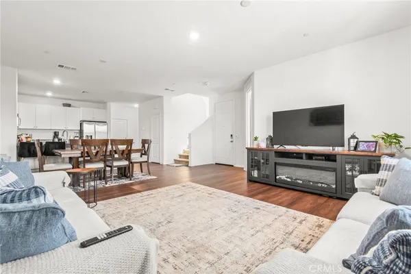 a spacious bedroom with a bed and a couch