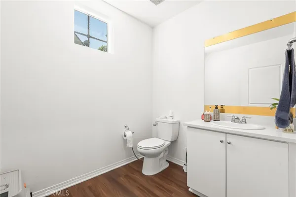 a bedroom with a bed and a view of kitchen
