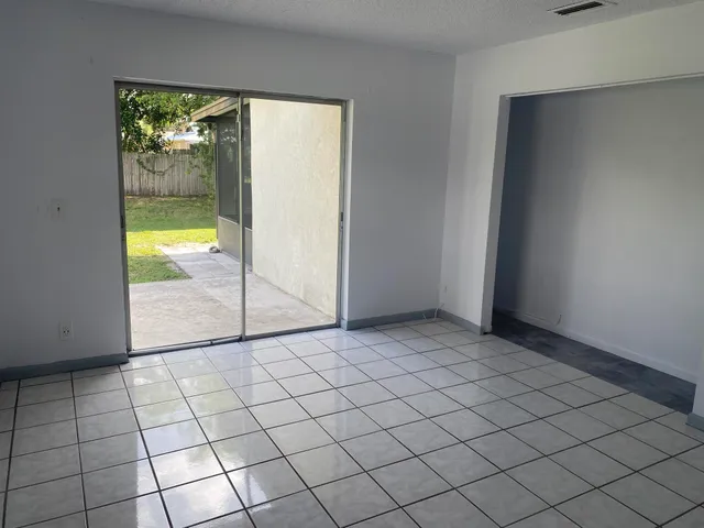 a view of an empty room and window