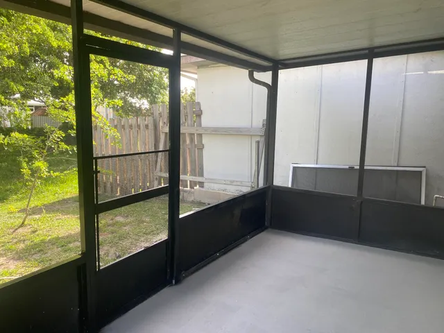 a view of an empty room and window