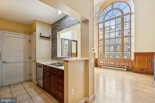 a kitchen with a stove a sink and a refrigerator