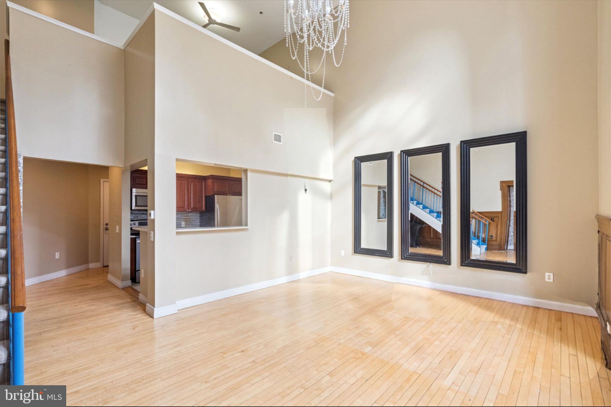 1600 Arch Street, Unit 2008 Philadelphia, PA 19103 - Photo 12 of 25 a view of an empty room with window and wooden floor