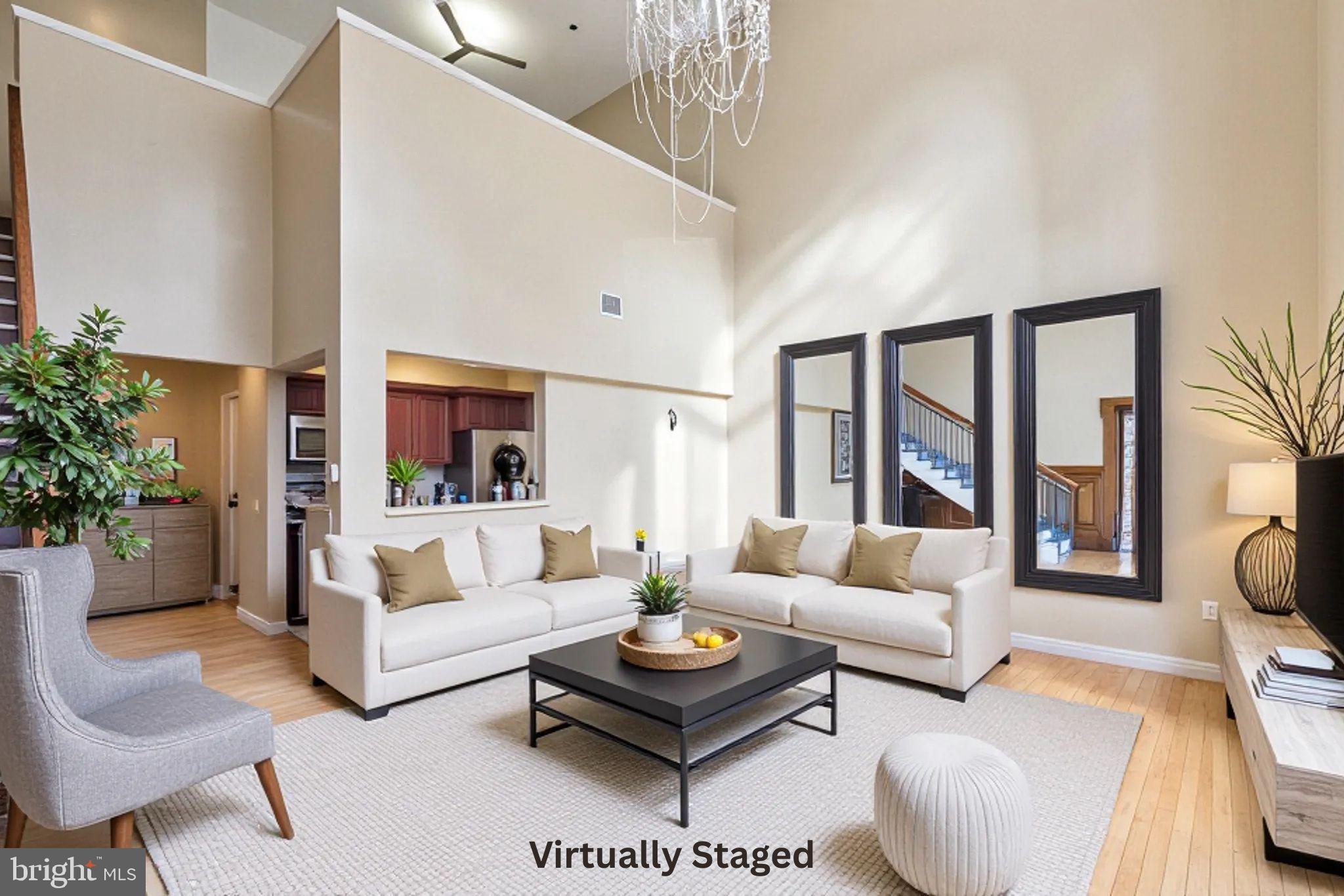1600 Arch Street, Unit 2008 Philadelphia, PA 19103 - Photo 22 of 25 a living room with furniture potted plant and a large window