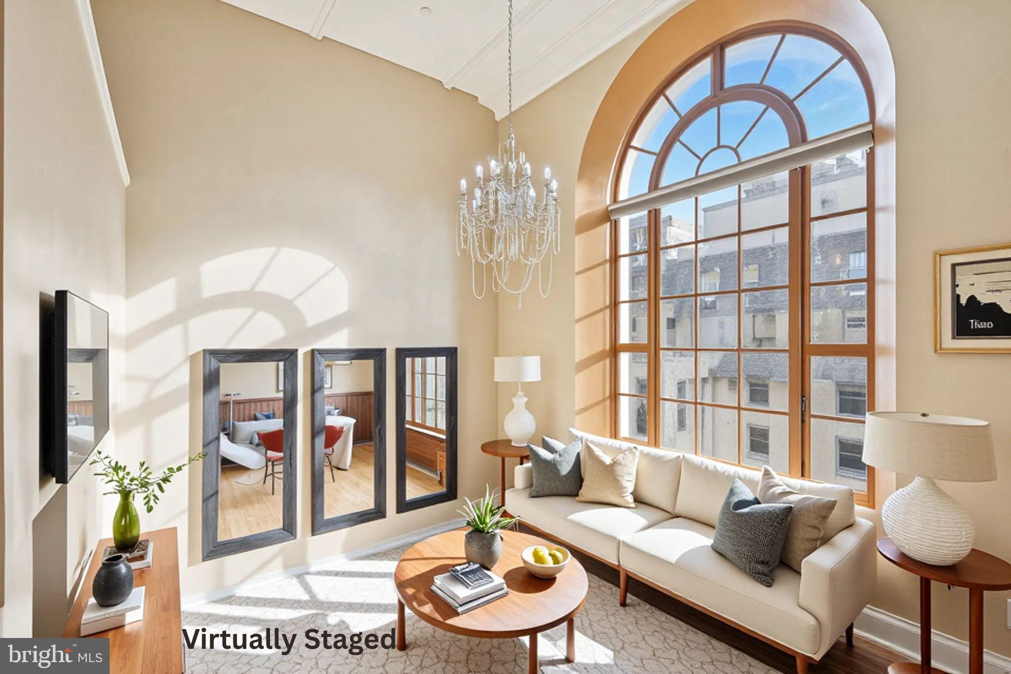 1600 Arch Street, Unit 2008 Philadelphia, PA 19103 - Photo 23 of 25 a living room with furniture and a large window