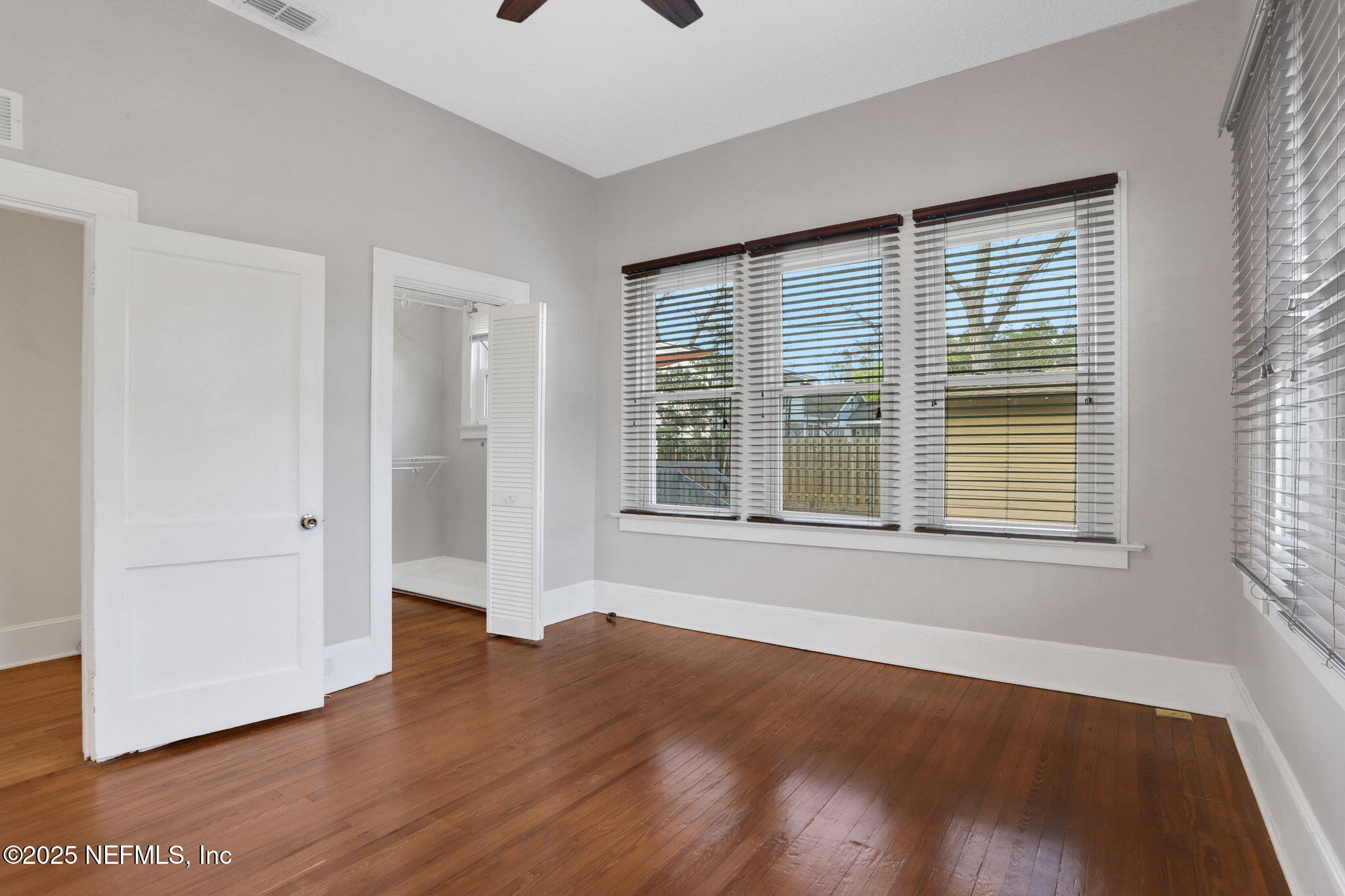 1393 Wolfe Street Jacksonville, FL 32205 - Photo 15 of 36 a view of an empty room with wooden floor and a window