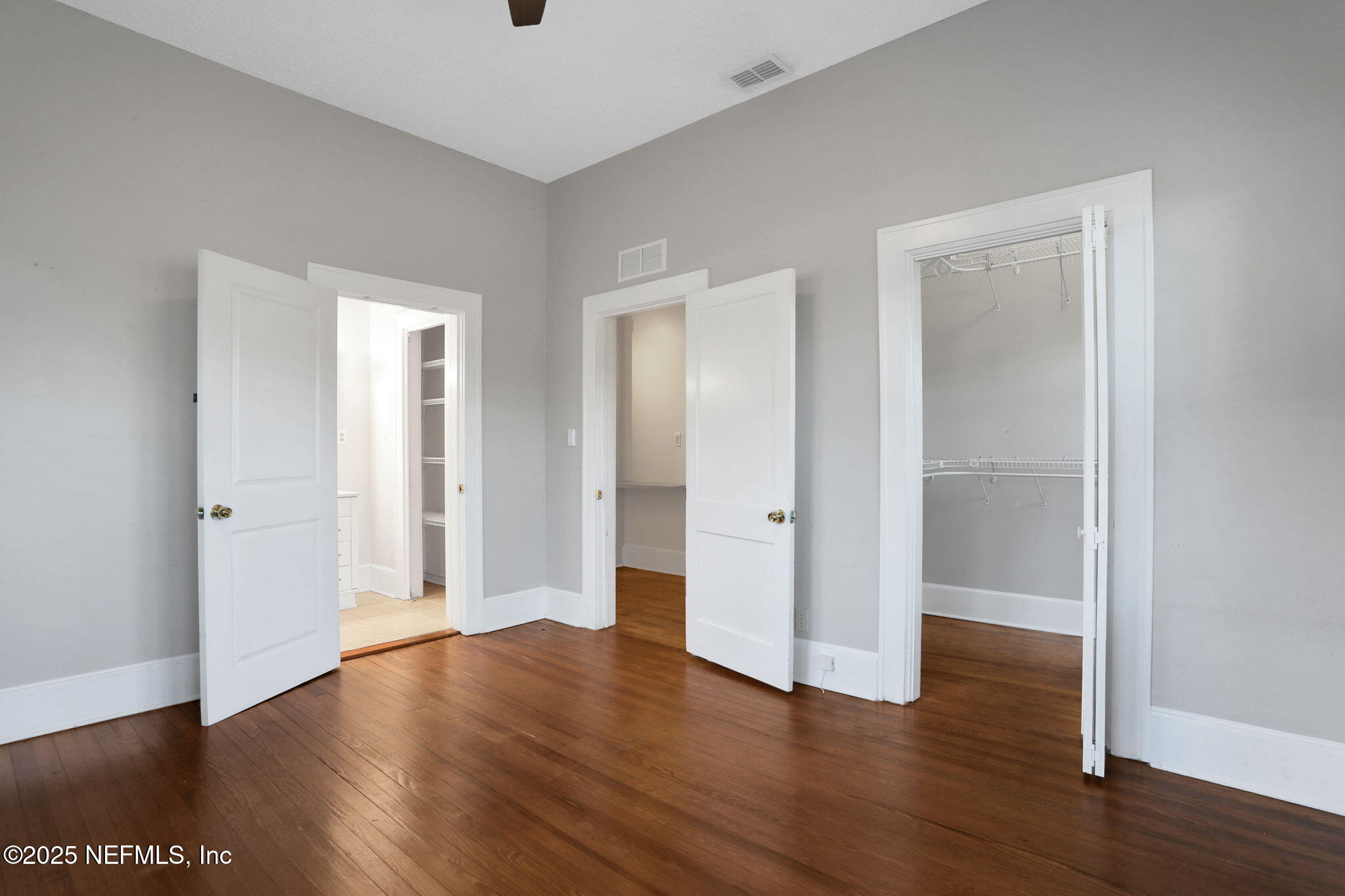 1393 Wolfe Street Jacksonville, FL 32205 - Photo 16 of 36 a view of an empty room with wooden floor