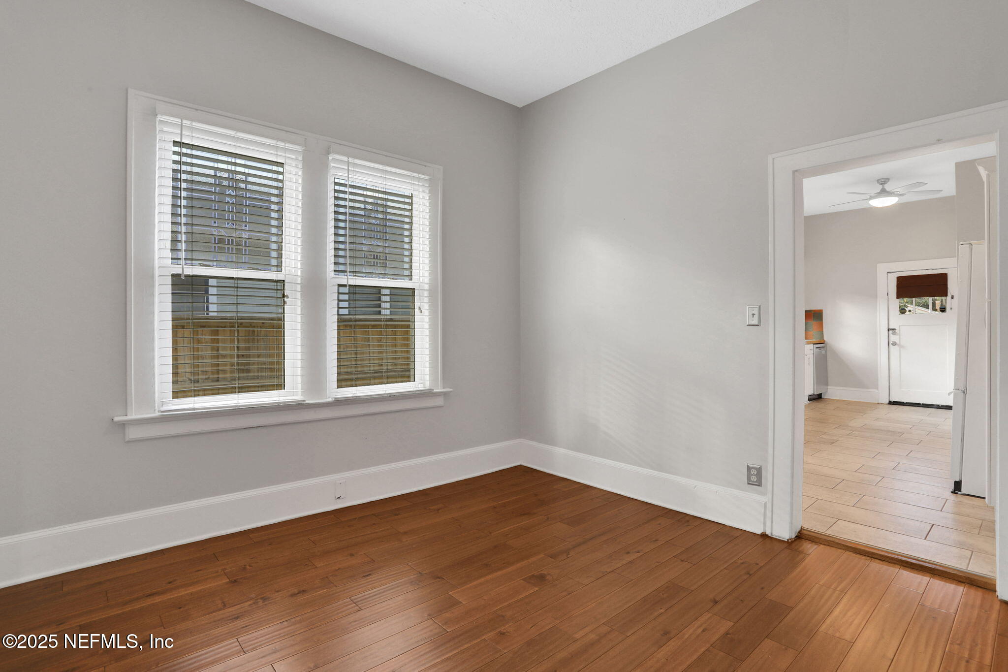 1393 Wolfe Street Jacksonville, FL 32205 - Photo 20 of 36 an empty room with wooden floor and windows