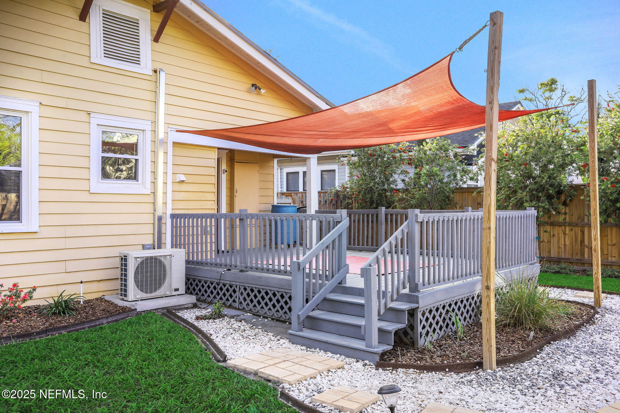1393 Wolfe Street Jacksonville, FL 32205 - Photo 29 of 36 a view of a chair and tables back yard of the house