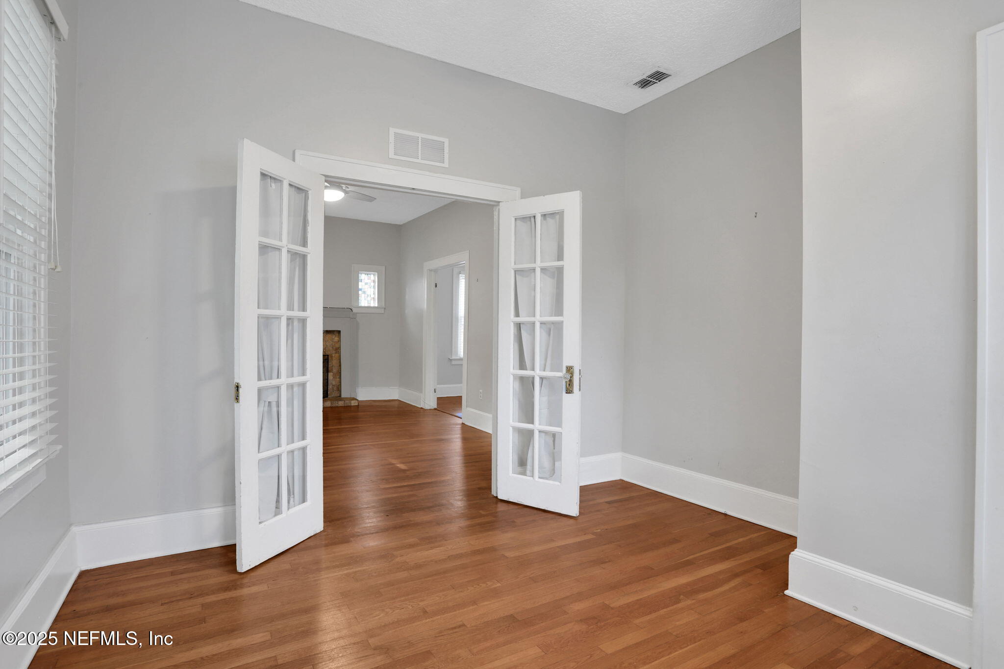 1393 Wolfe Street Jacksonville, FL 32205 - Photo 8 of 36 a view of a hallway with wooden floor