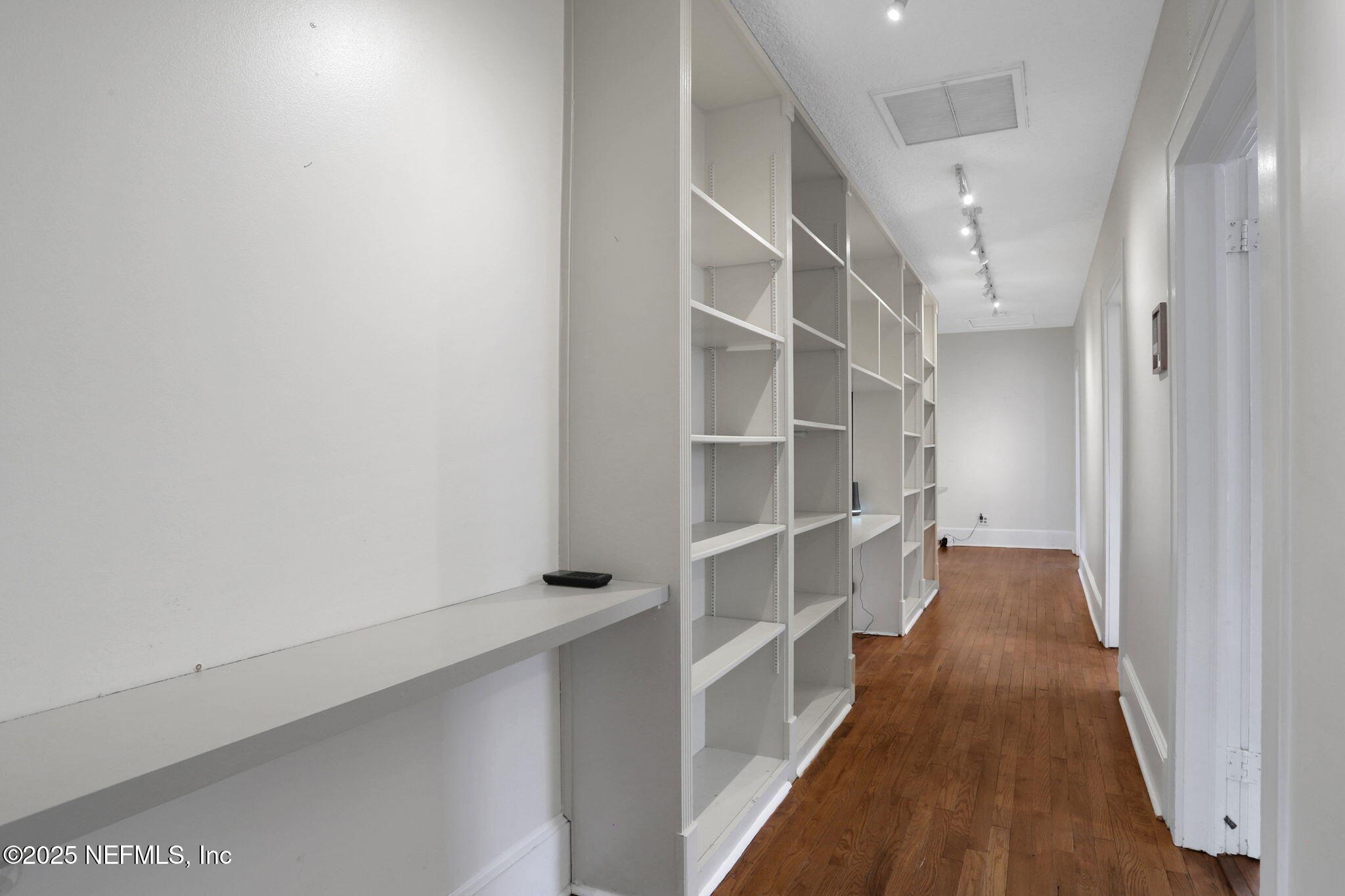 1393 Wolfe Street Jacksonville, FL 32205 - Photo 10 of 36 a view of walk in closet with empty racks
