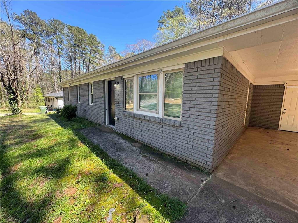 2536 Butner Road Atlanta, GA 30331 - Photo 3 of 19 a view of a house with a yard