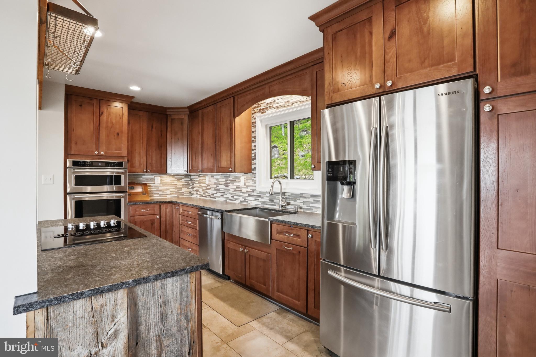 19897 Foresthill Road Bluemont, VA 20135 - Photo 16 of 39 a kitchen with stainless steel appliances granite countertop a refrigerator a sink and a stove