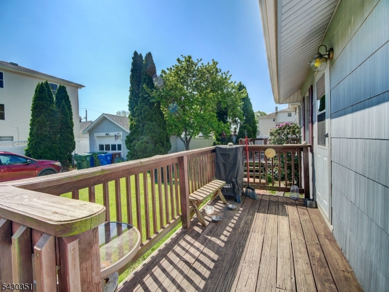 105 Lower Road Linden, NJ 07036 - Photo 11 of 16 a view of balcony with wooden floor and fence