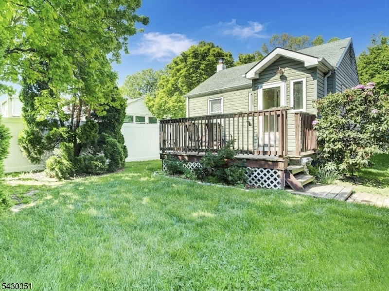 105 Lower Road Linden, NJ 07036 - Photo 12 of 16 a front view of a house with a yard and fence