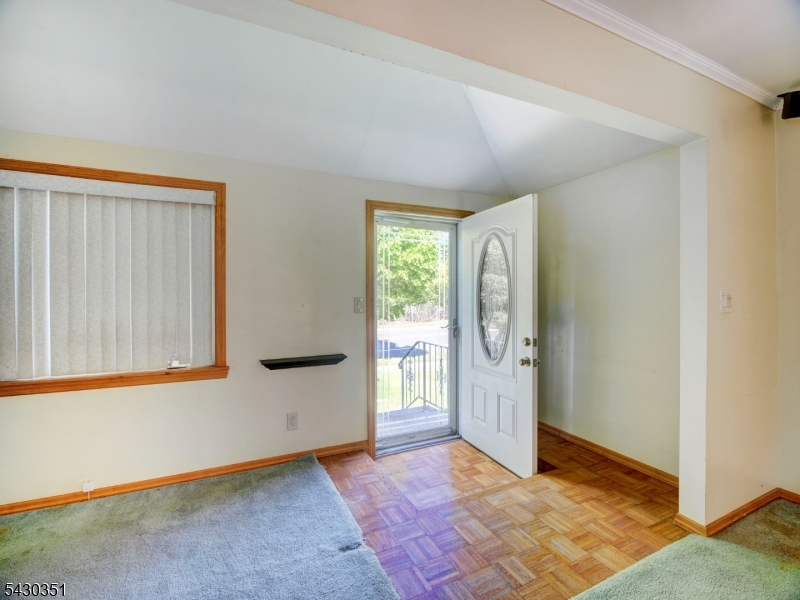 105 Lower Road Linden, NJ 07036 - Photo 2 of 16 a view of an empty room with window and refrigerator