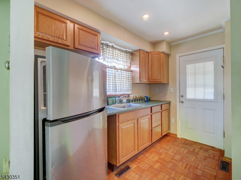 105 Lower Road Linden, NJ 07036 - Photo 5 of 16 a kitchen with stainless steel appliances granite countertop a refrigerator and a sink