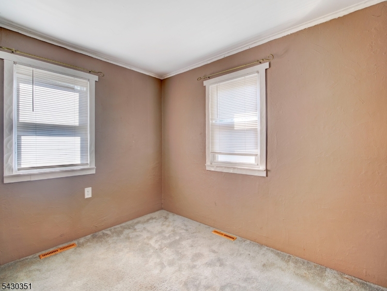105 Lower Road Linden, NJ 07036 - Photo 6 of 16 a view of an empty room with a window