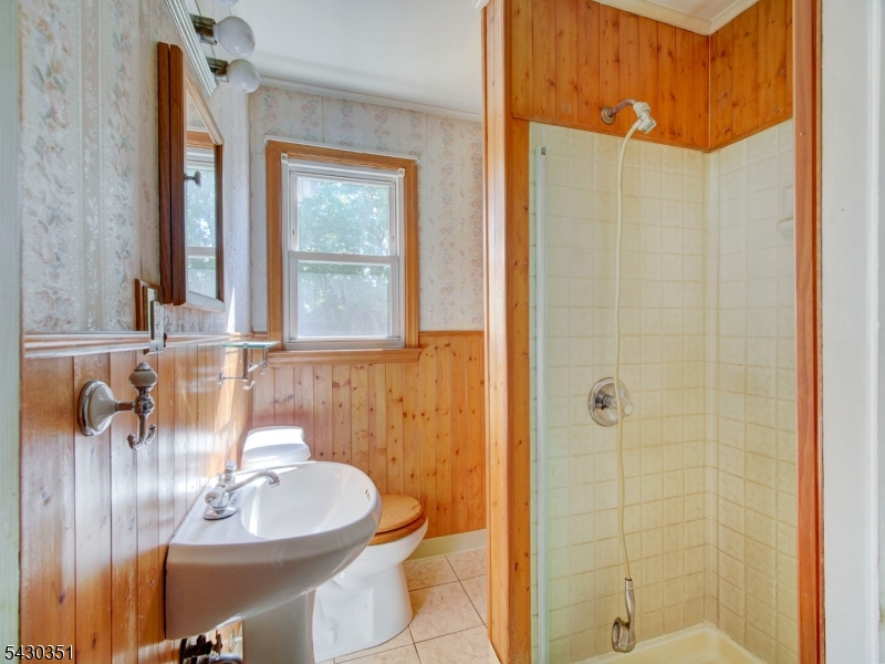 105 Lower Road Linden, NJ 07036 - Photo 7 of 16 a bathroom with a sink a toilet and shower