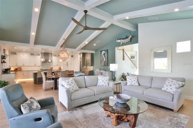 a large kitchen with a table and chairs