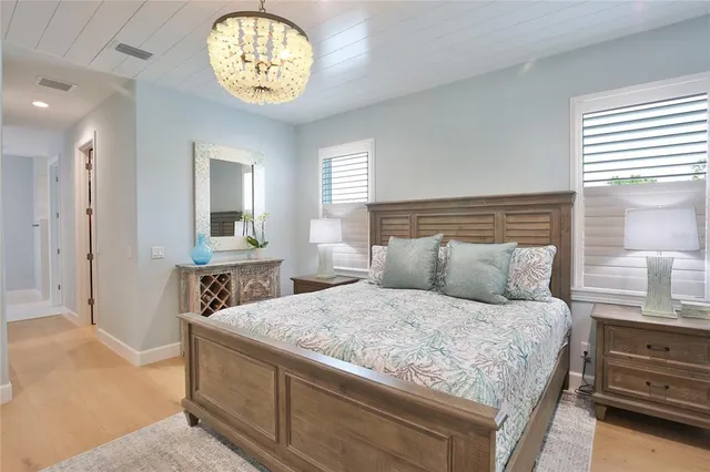 a bathroom with a granite countertop sink a mirror and a shower