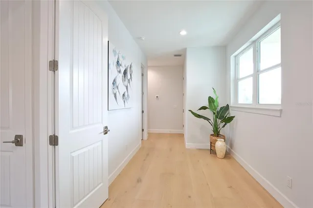 a bedroom with a bed and a night stand