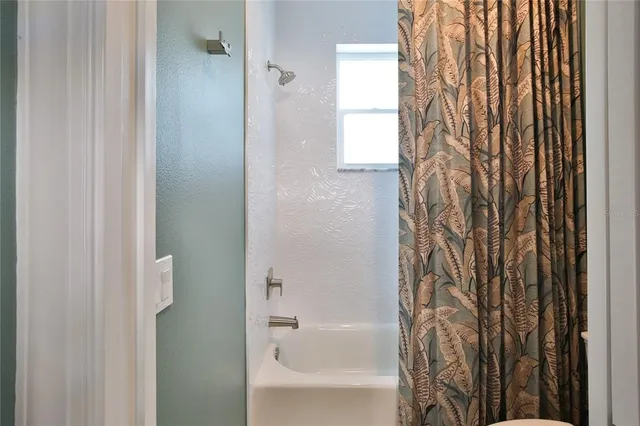 a view of swimming pool with outdoor seating and city view