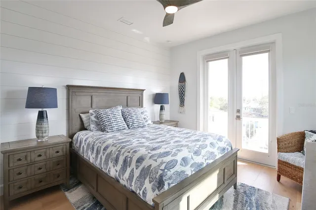 an outdoor space with lots of white furniture and a fire hydrant