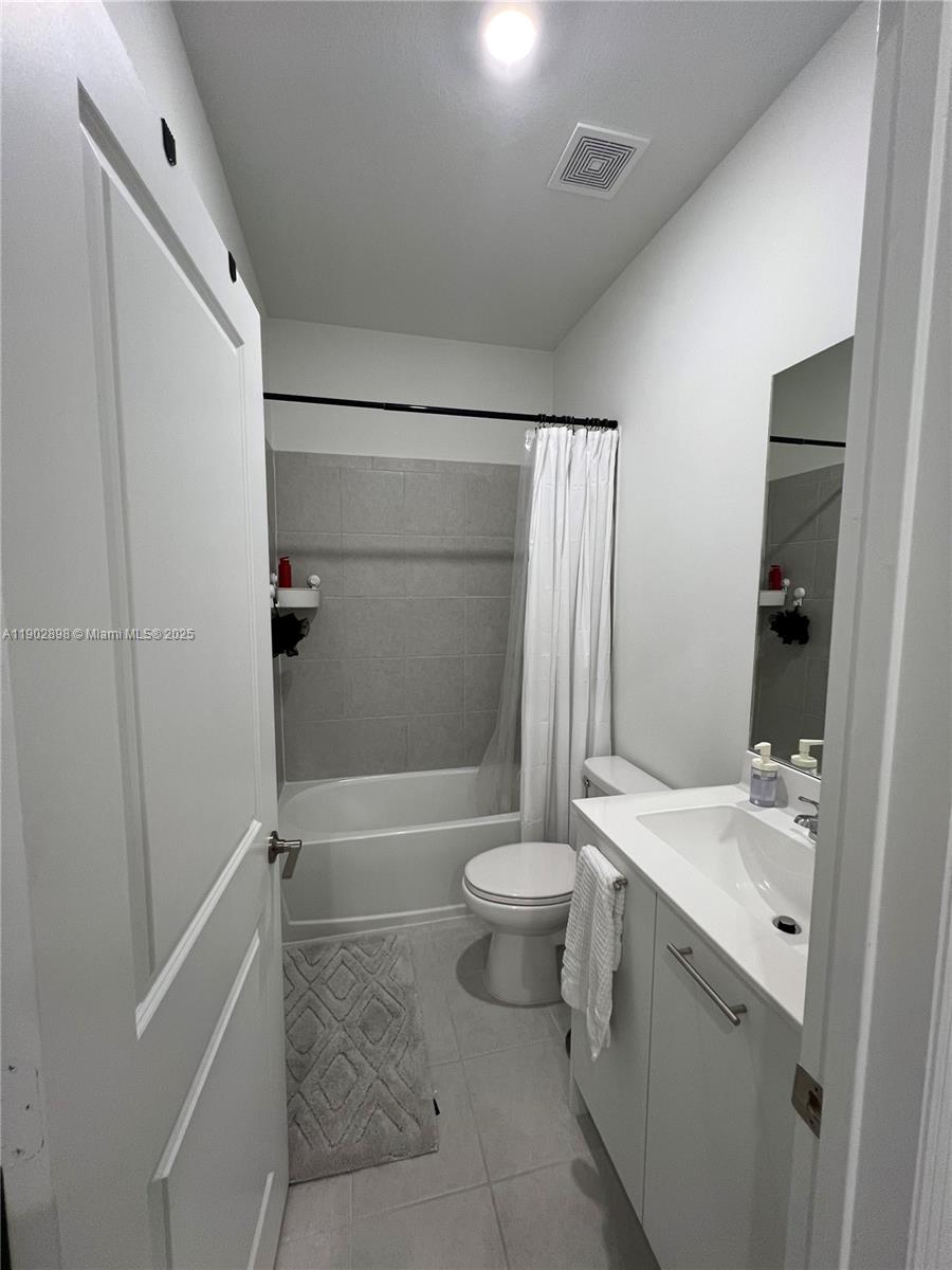12142 Northwest 24th Court Miami, FL 33167 - Photo 12 of 20 a bathroom with a sink a toilet and shower
