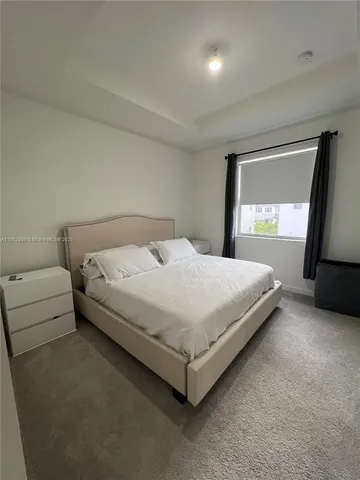 a bathroom with a toilet sink and shower
