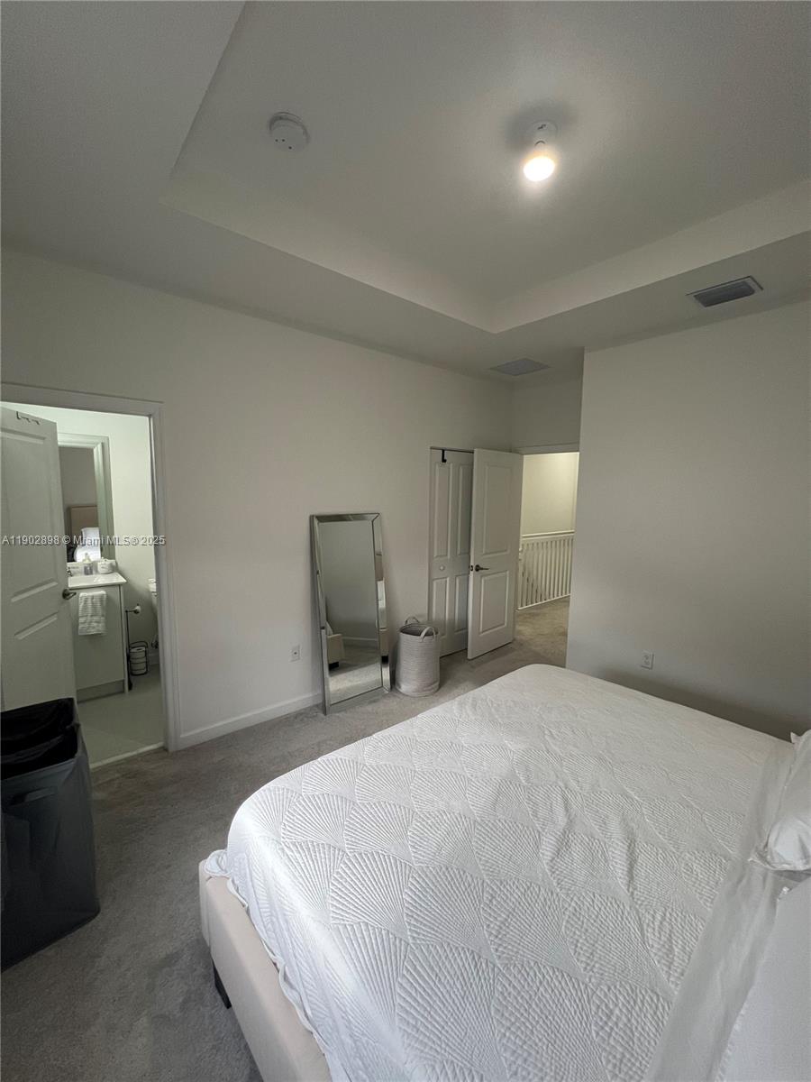 12142 Northwest 24th Court Miami, FL 33167 - Photo 15 of 20 a large white bed in a white room