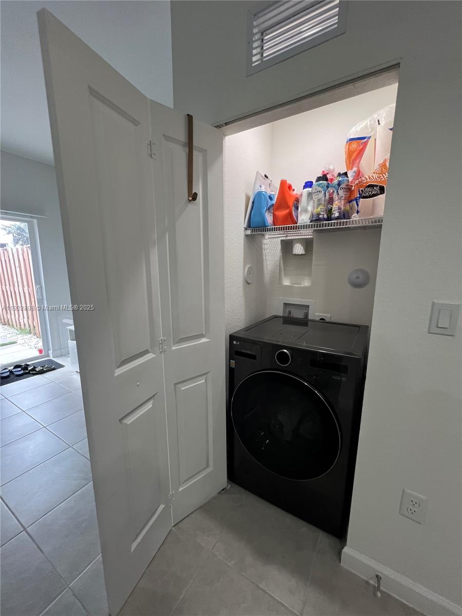 12142 Northwest 24th Court Miami, FL 33167 - Photo 18 of 20 a utility room with dryer and washer