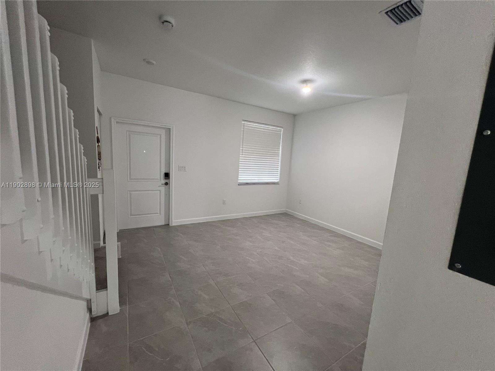 12142 Northwest 24th Court Miami, FL 33167 - Photo 5 of 20 a view of empty room