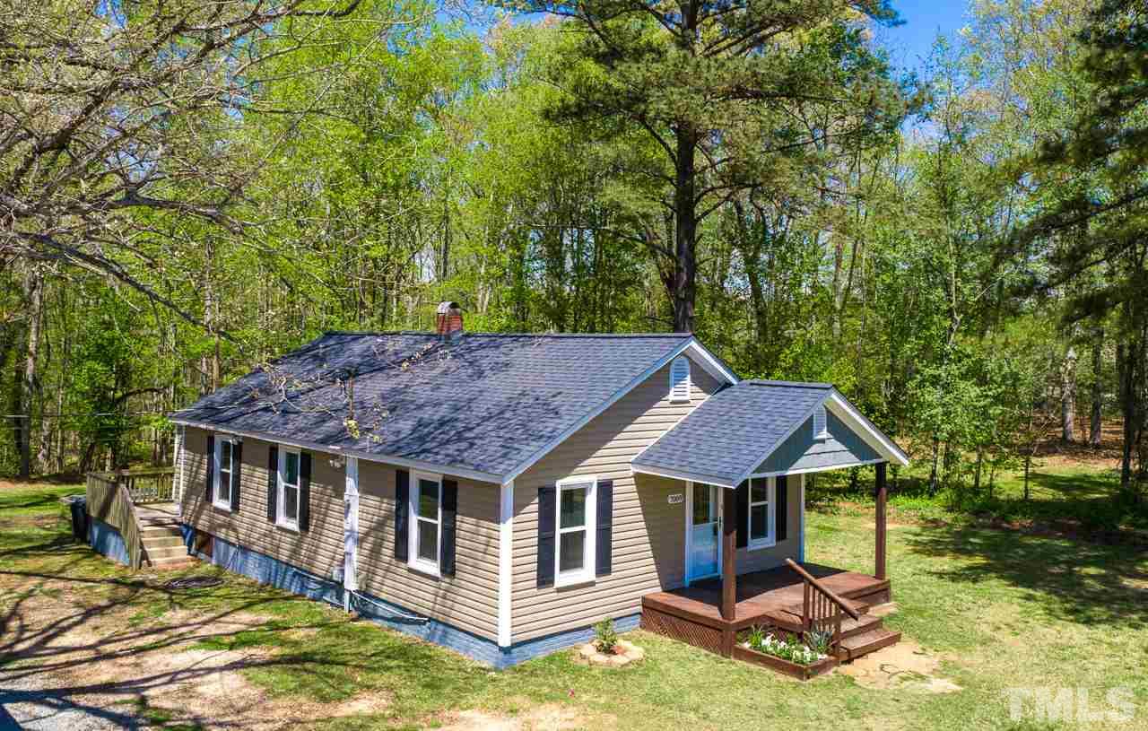7089 Virgilina Road Roxboro, NC 27574 - Photo 1 of 28 a aerial view of a house with yard porch and furniture